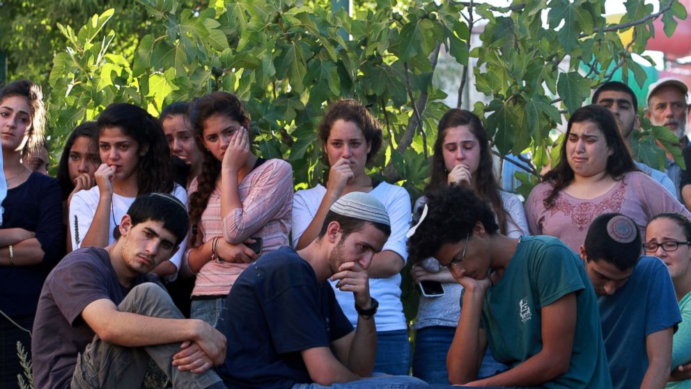 PHOTO: Friends and relatives of Israeli Hallel Yaffa Ariel, a 13-year-old girl who was fatally stabbed by a Palestinian attacker in her home, mourn during her funeral in Kiryat Arba, outside the West Bank city of Hebron on June 30, 2016.