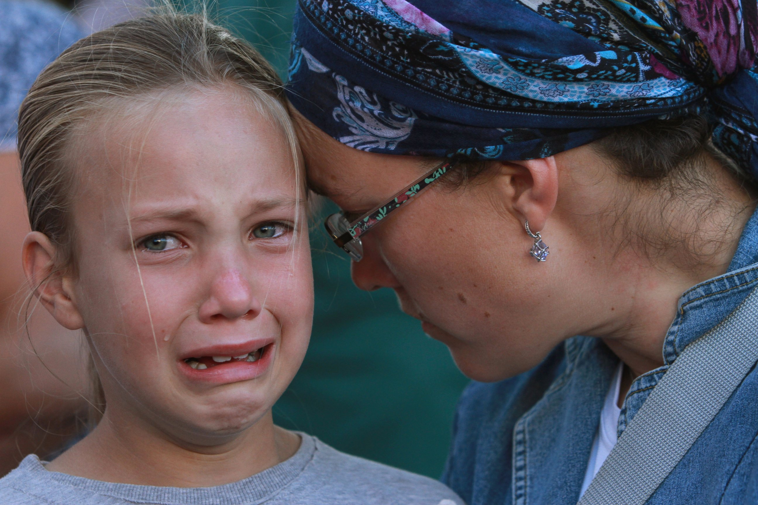 PHOTO: Friends and relatives of Israeli Hallel Yaffa Ariel, a 13-year-old girl who was fatally stabbed by a Palestinian attacker in her home, mourn during her funeral in Kiryat Arba, outside the West Bank city of Hebron on June 30, 2016. 