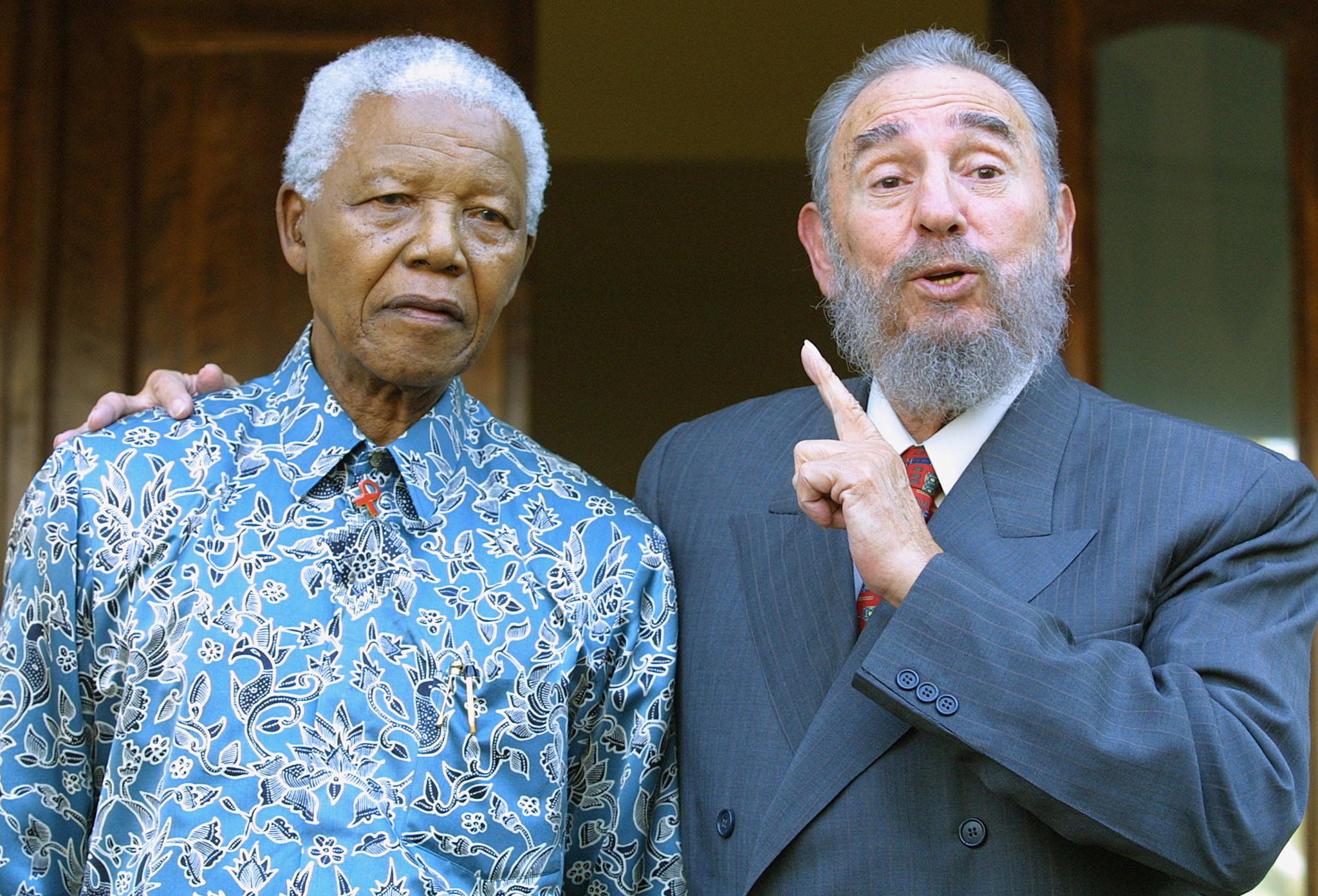 PHOTO: Cuban president Fidel Castro meets with former South African president Nelson Mandela at Mandela's office in Johannesburg, Sept. 2, 2001.