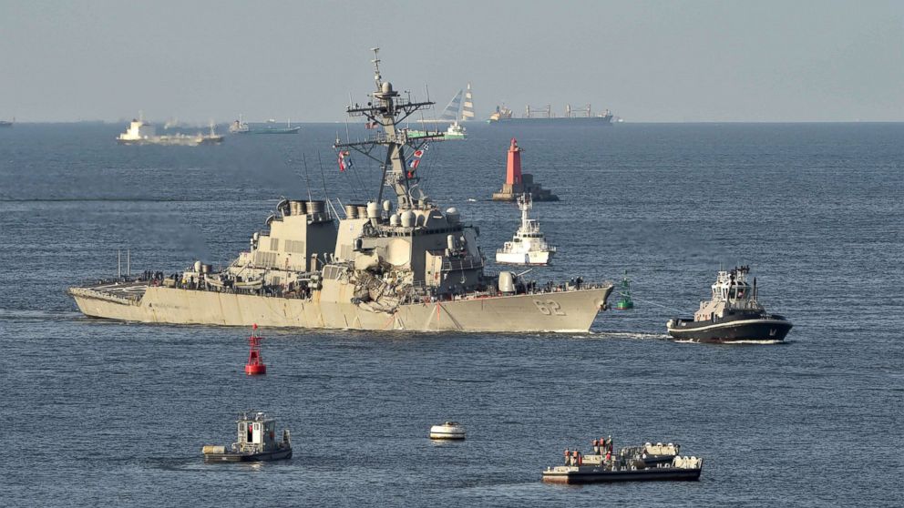 A tugboat leads the US Navy guided missile destroyer USS Fitzgerald sails into port at the US Naval Yokosuka Base, Kanagawa prefecture on June 17, 2017. 
