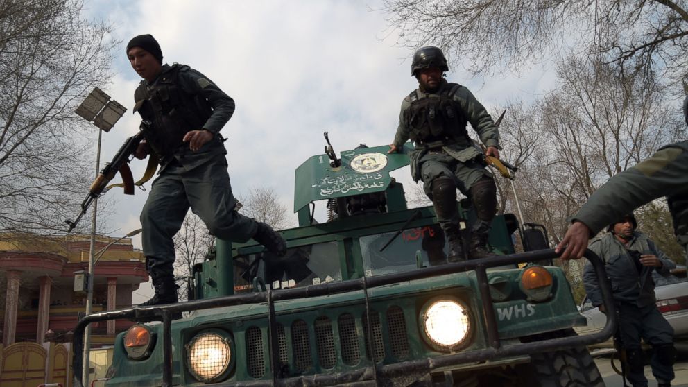 Afghan policemen leap from a vehicle as they arrive at the site of an explosion in Kabul, March 8, 2017. 

An explosion and gunfire rattled Kabul's diplomatic district, as insurgents attacked Afghanistan's largest military hospital, officials said.  / AFP PHOTO / SHAH MARAISHAH MARAI/AFP/Getty Images