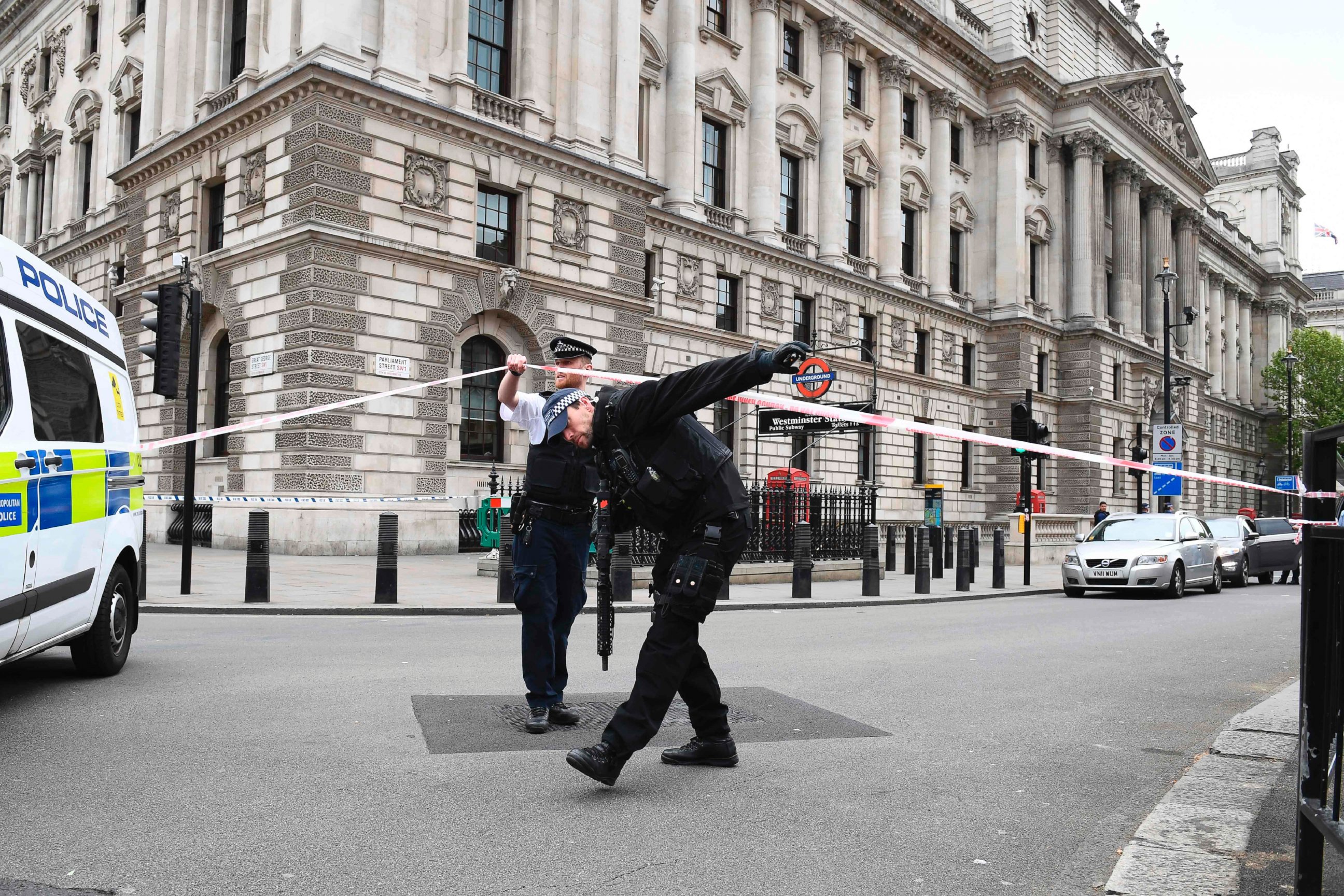 PHOTO: British police officers secure a cordon near the scene on Whitehall near the Houses of Parliament in central London on April 27, 2017 where a man was detained before being taken away by police.