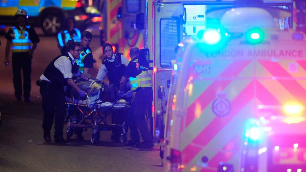 PHOTO: Police officers and members of the emergency services attend to a person injured in an incident on London Bridge in central London on June 3, 2017.