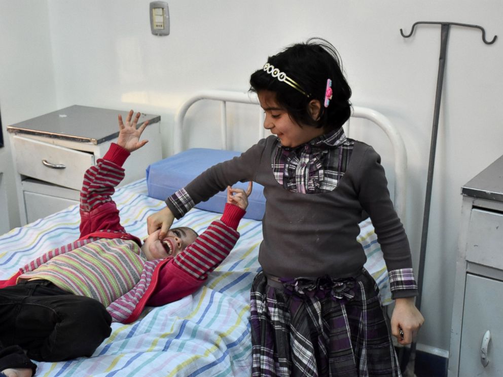PHOTO: Syrian girls, who had been held prisoner by opposition forces, await treatment at a hospital in Aleppo, April 12, 2017, upon their release as part of an exchange of prisoners between rebels and government forces.