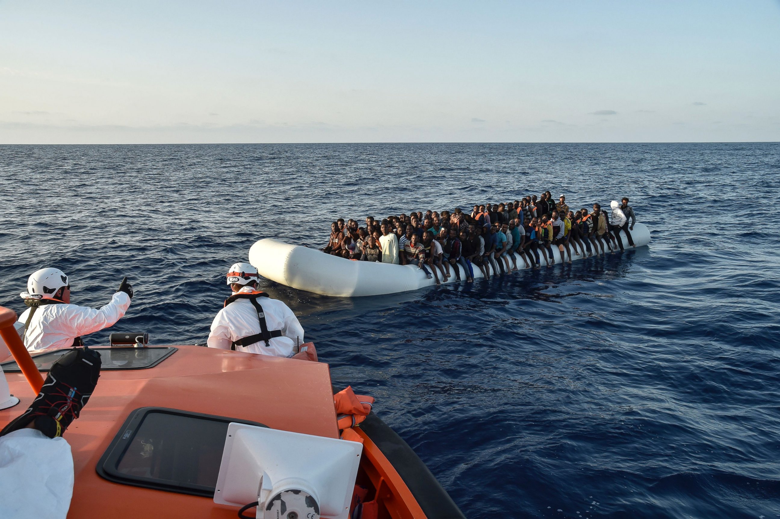 PHOTO: Migrants aboard a rubber boat wait to be rescued by the Maltese NGO Moas and the Italian Red Cross off the Libyan coast in the  Mediterranean Sea, Nov. 3, 2016.