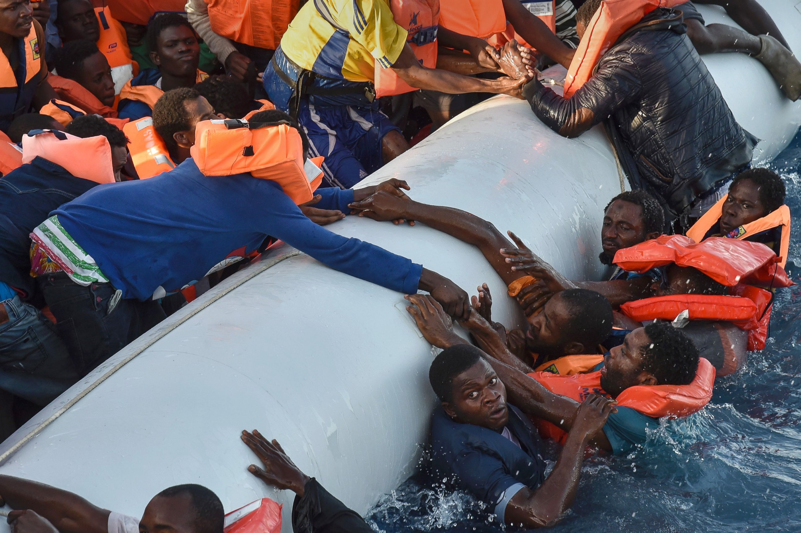 PHOTO: Refugees panic as they fall in the water during a rescue operation off the Libyan coast in the  Mediterranean Sea, Nov. 3, 2016.