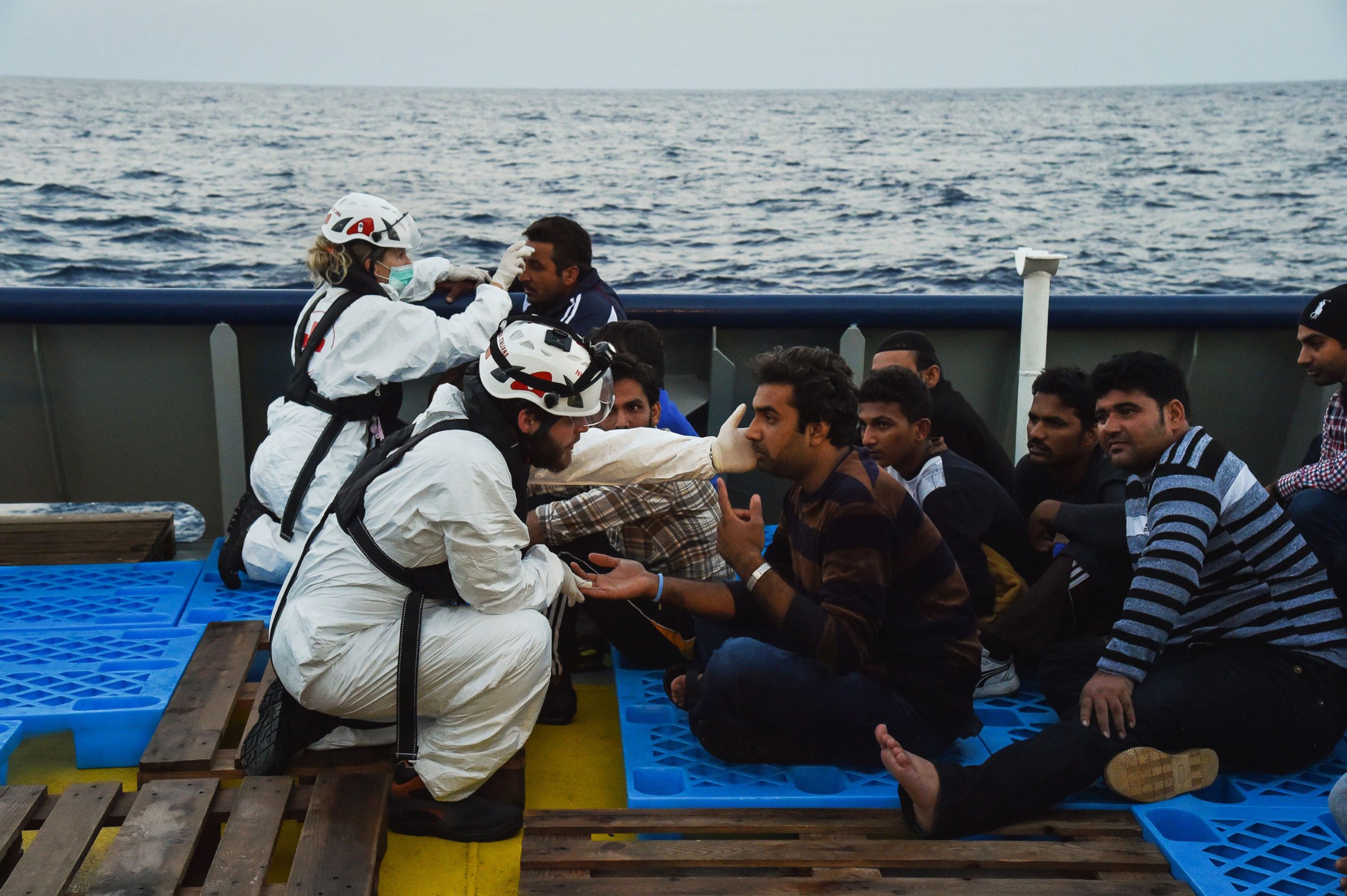 PHOTO: Medics from the Italian Red Cross attend to the rescued migrants aboard the ship Topaz Responder run by Maltese NGO MOAS and Italian Red Cross off the Libyan coast, Nov. 3, 2016.