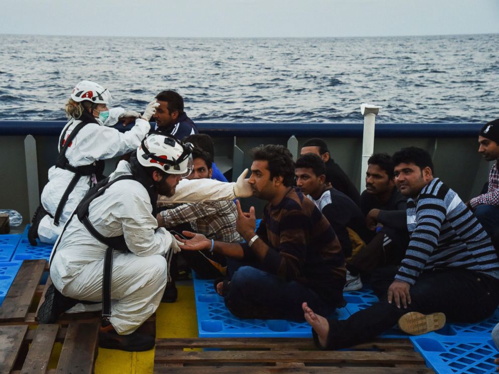 PHOTO: Medics from the Italian Red Cross attend to the rescued migrants aboard the ship Topaz Responder run by Maltese NGO MOAS and Italian Red Cross off the Libyan coast, Nov. 3, 2016.