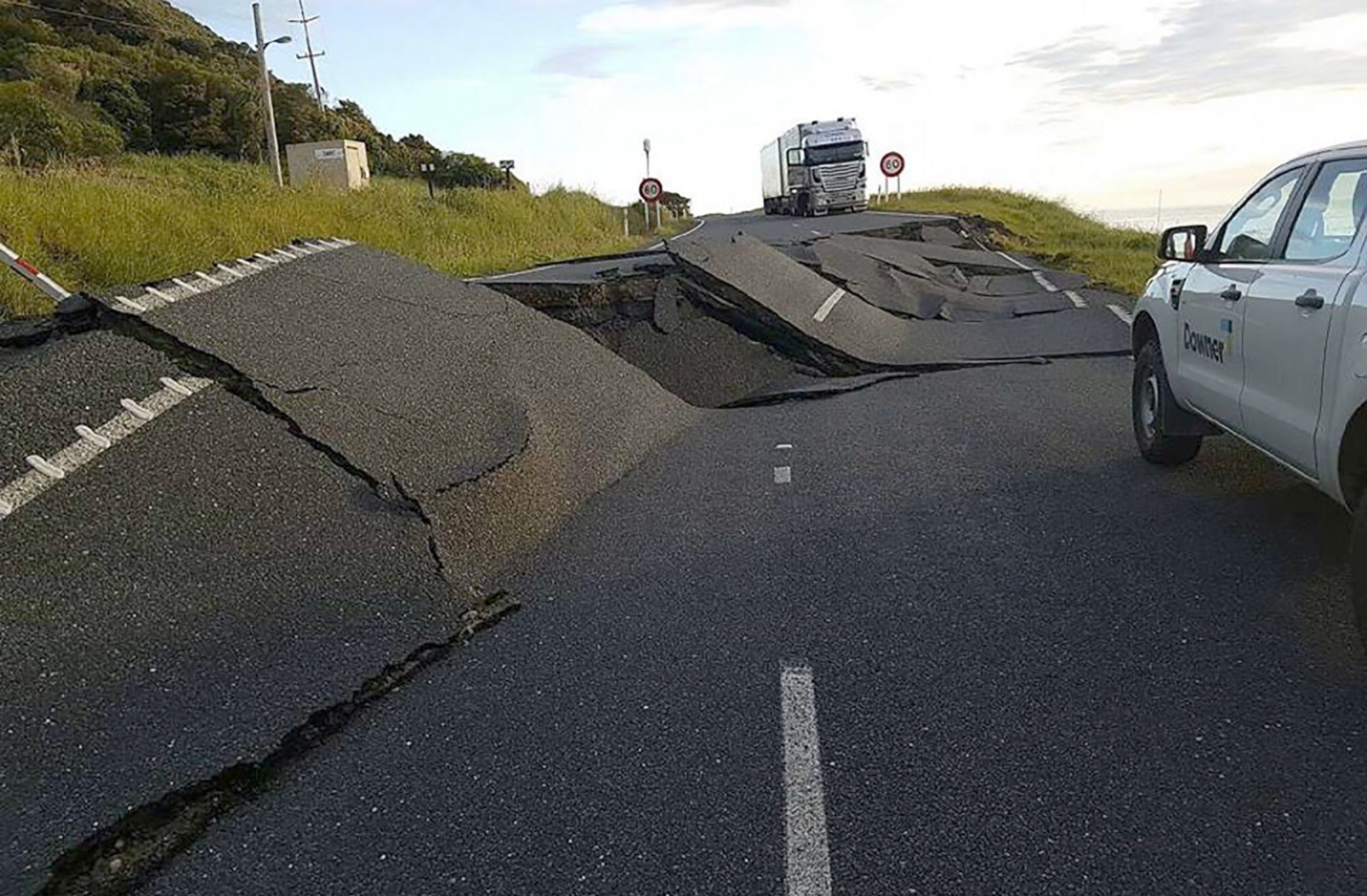 PHOTO: Cars and trucks are halted due to earthquake damage on State Highway One near Oaro on the South Island's east coast in New Zealand. 
