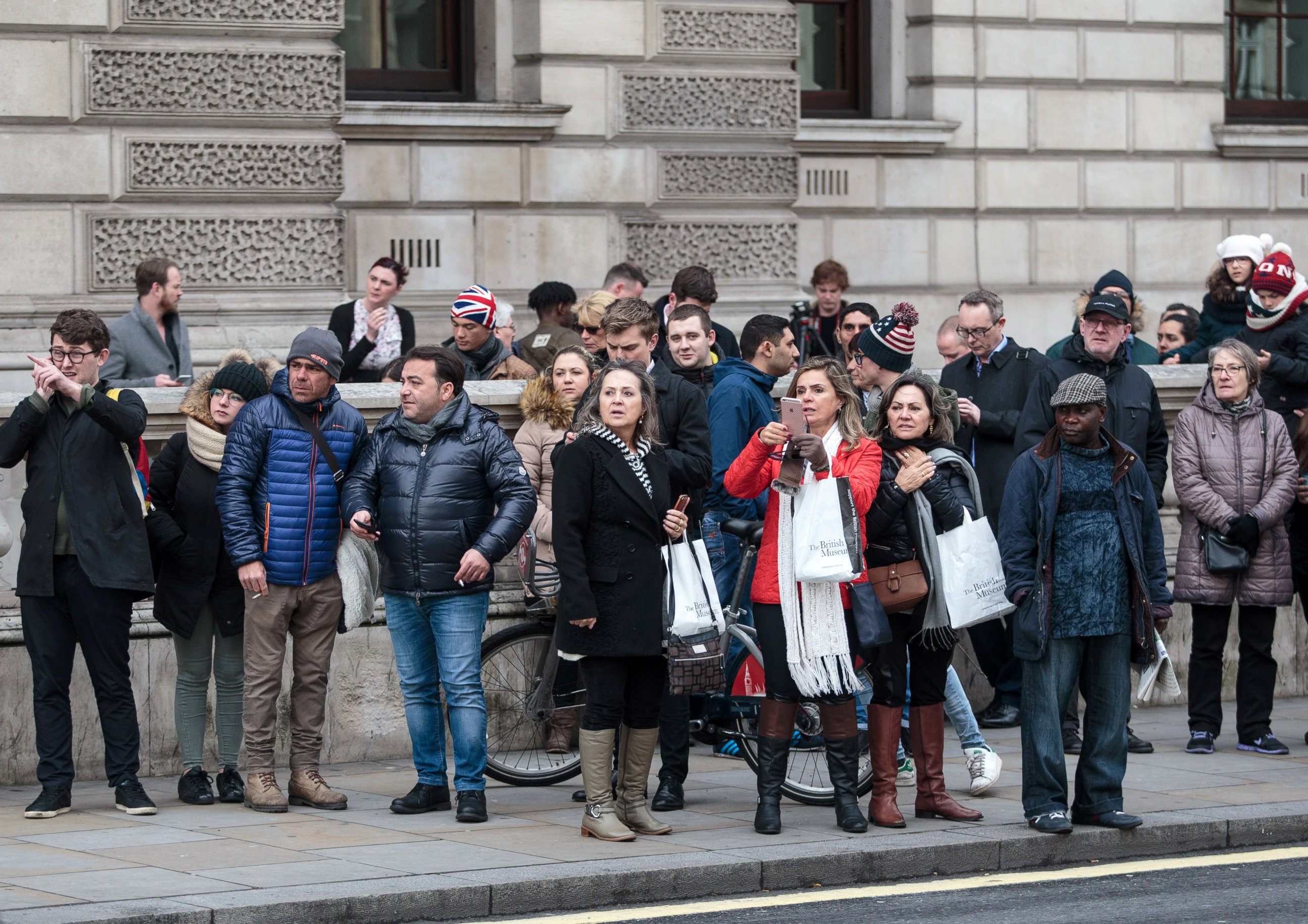 PHOTO: Members of the public look on as roads are closed off by Police around Westminster Bridge and the Houses of Parliament during an incident on March 22, 2017 in London.