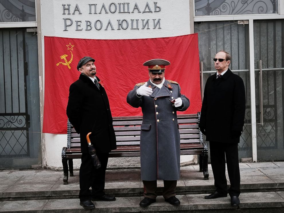 PHOTO: Performers dressed as Vladimir Lenin and Joseph Stalin stand in central Moscow on March 3, 2017.