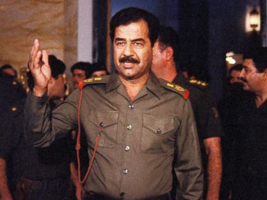 PHOTO: Saddam Hussein welcomes people In Baghdad, Oct. 17, 1983.