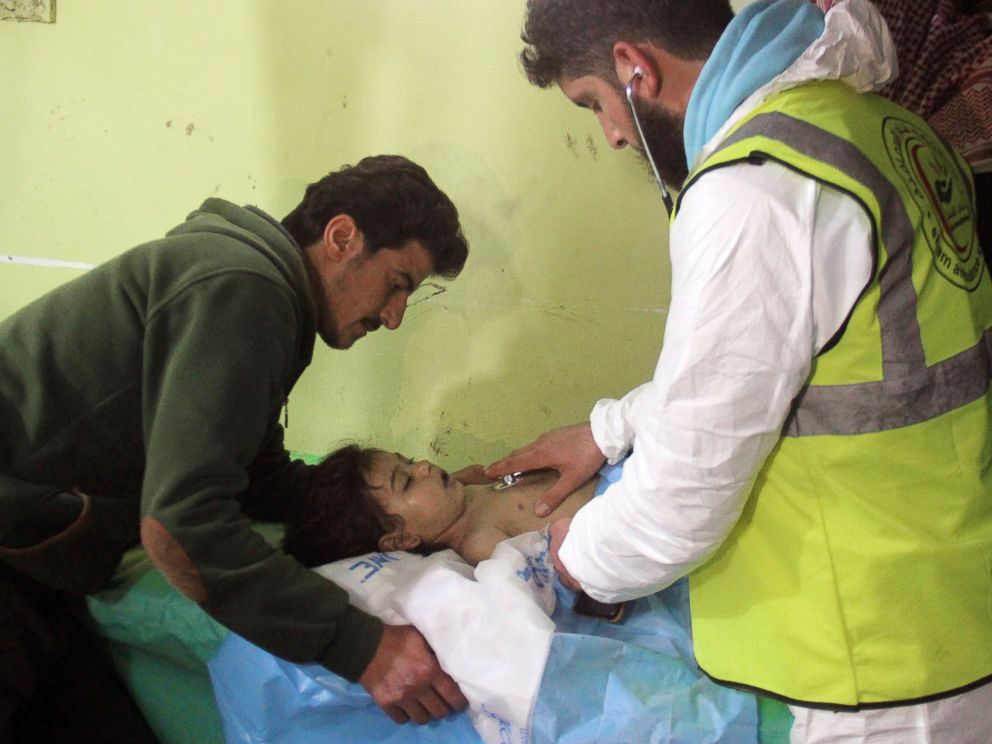 PHOTO: An unconscious Syrian child receives treatment at a hospital in Khan Sheikhun, a rebel-held town in the northwestern Syrian Idlib province, following a suspected toxic gas attack on April 4, 2017.