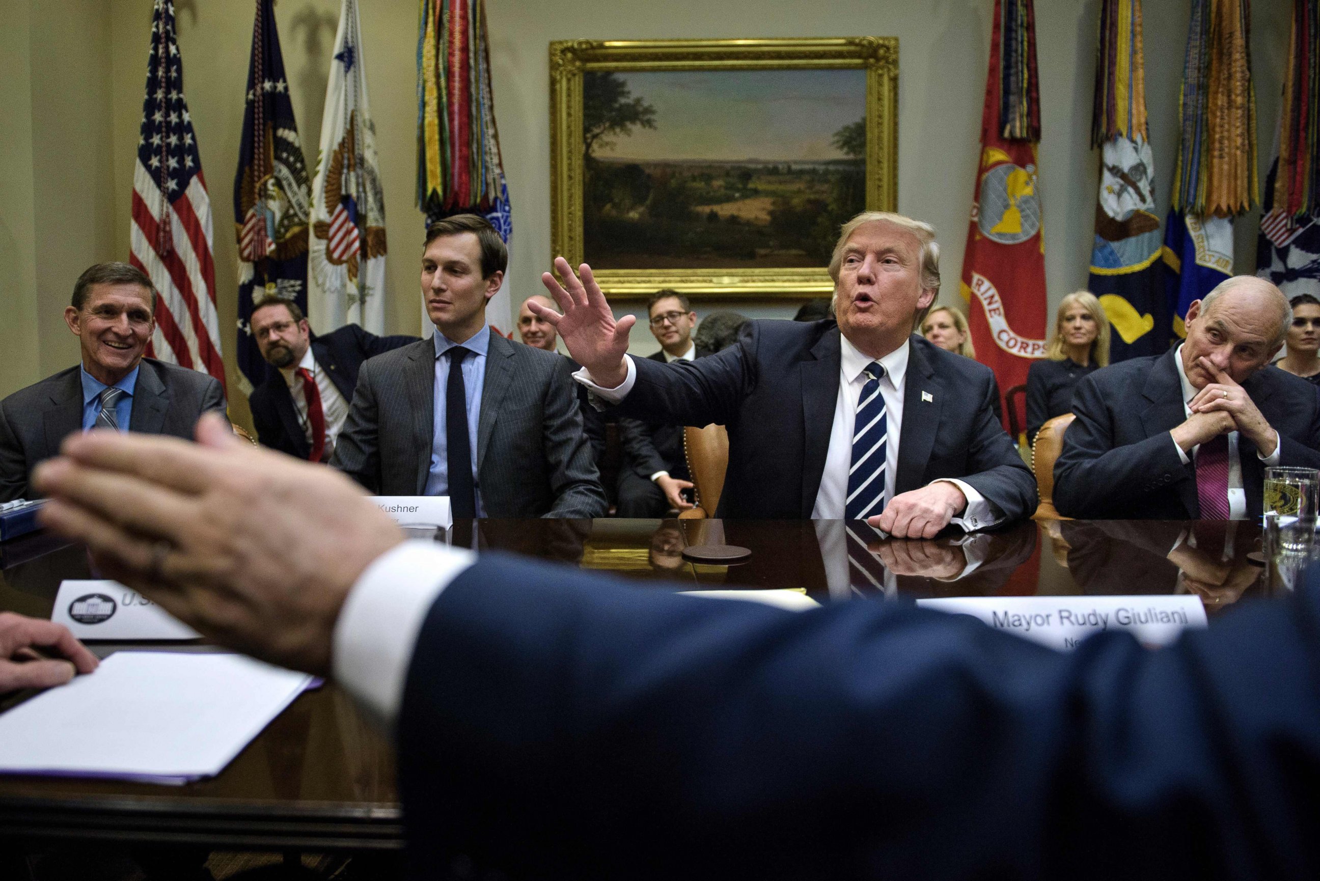 PHOTO:General Mike Flynn (L), Jared Kushner (2L),John Kelly (R) and others listen while US President Donald Trump speaks at the beginning of a meeting on cyber security in the Roosevelt Room of the White House, Jan. 31, 2017, in Washington. 