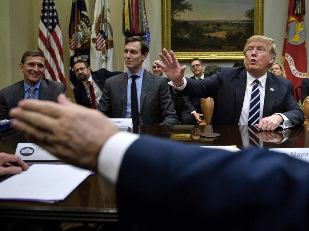 PHOTO:General Mike Flynn (L), Jared Kushner (2L),John Kelly (R) and others listen while US President Donald Trump speaks at the beginning of a meeting on cyber security in the Roosevelt Room of the White House, Jan. 31, 2017, in Washington.