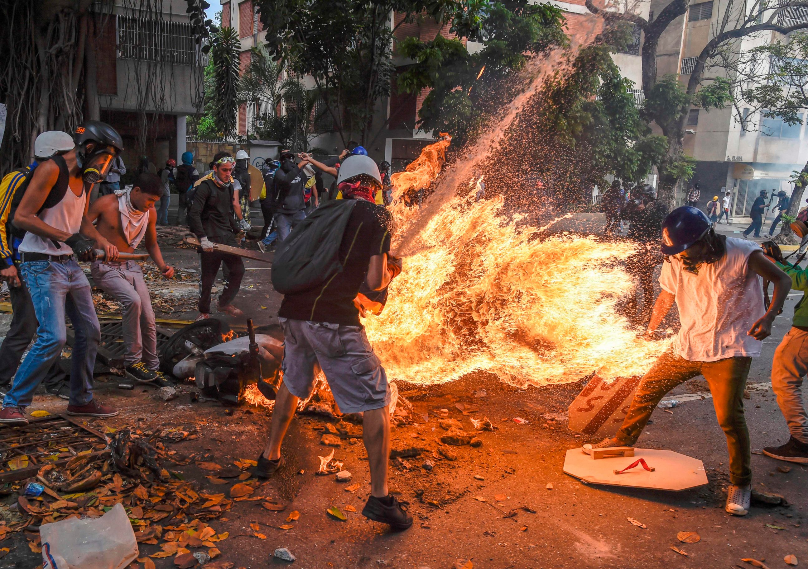 PHOTO: The gas tank of a police motorcycle explodes during clashes in a protest against Venezuelan President Nicolas Maduro, in Caracas on May 3, 2017.
