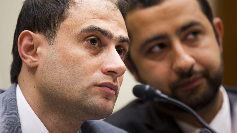 Dr. Mohamed Tennari listens to his translator during a hearing convened by the House Foreign Affairs Committee in Washington, June 17, 2015, to examine the use of chemical weapons in Syria by the Assad regime. 