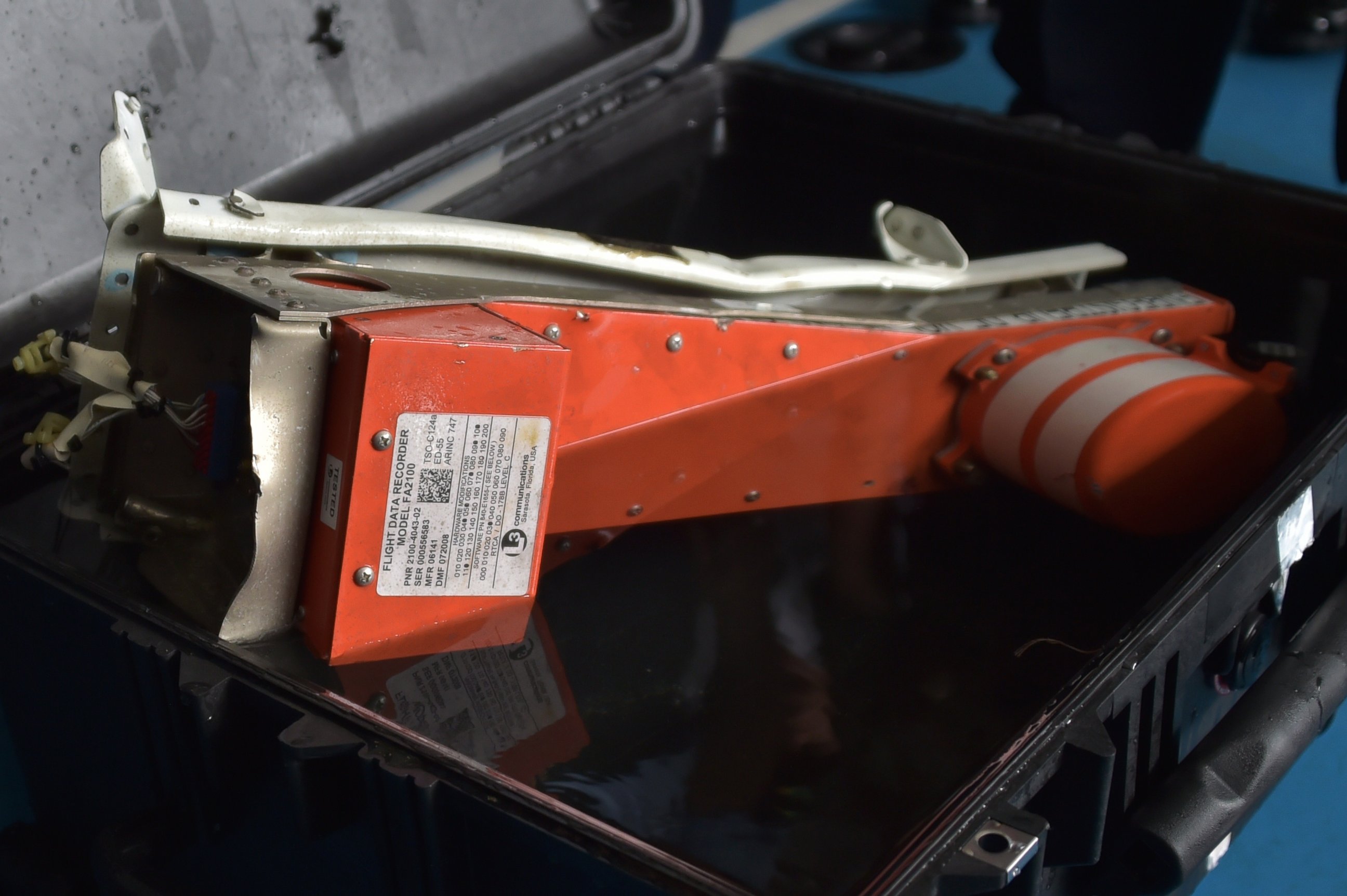 PHOTO: This picture taken onboard Indonesian navy vessel KRI Banda Aceh shows the Flight Data Recorder of the AirAsia flight QZ8501 after it was retrieved from the Java Sea on Jan. 12, 2015. 