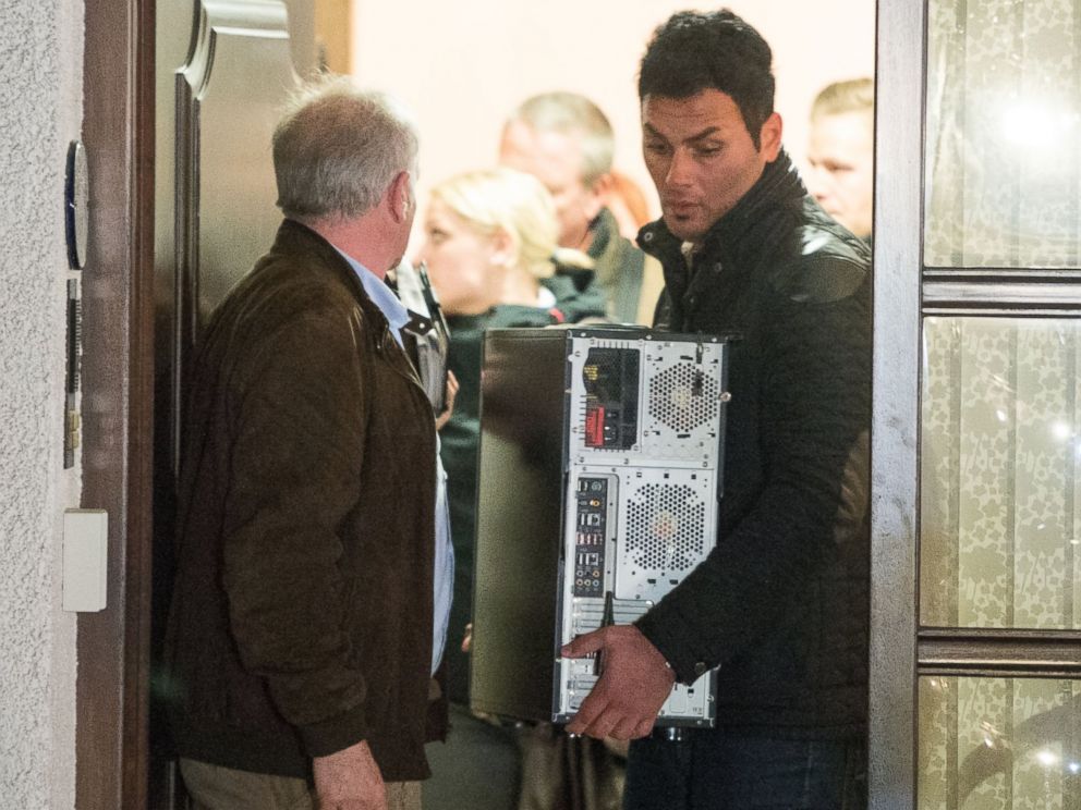PHOTO: Police carry a computer out of the residence of the parents of Andreas Lubitz, co-pilot on Germanwings flight 4U9525, March 26, 2015 in Montabaur, Germany.