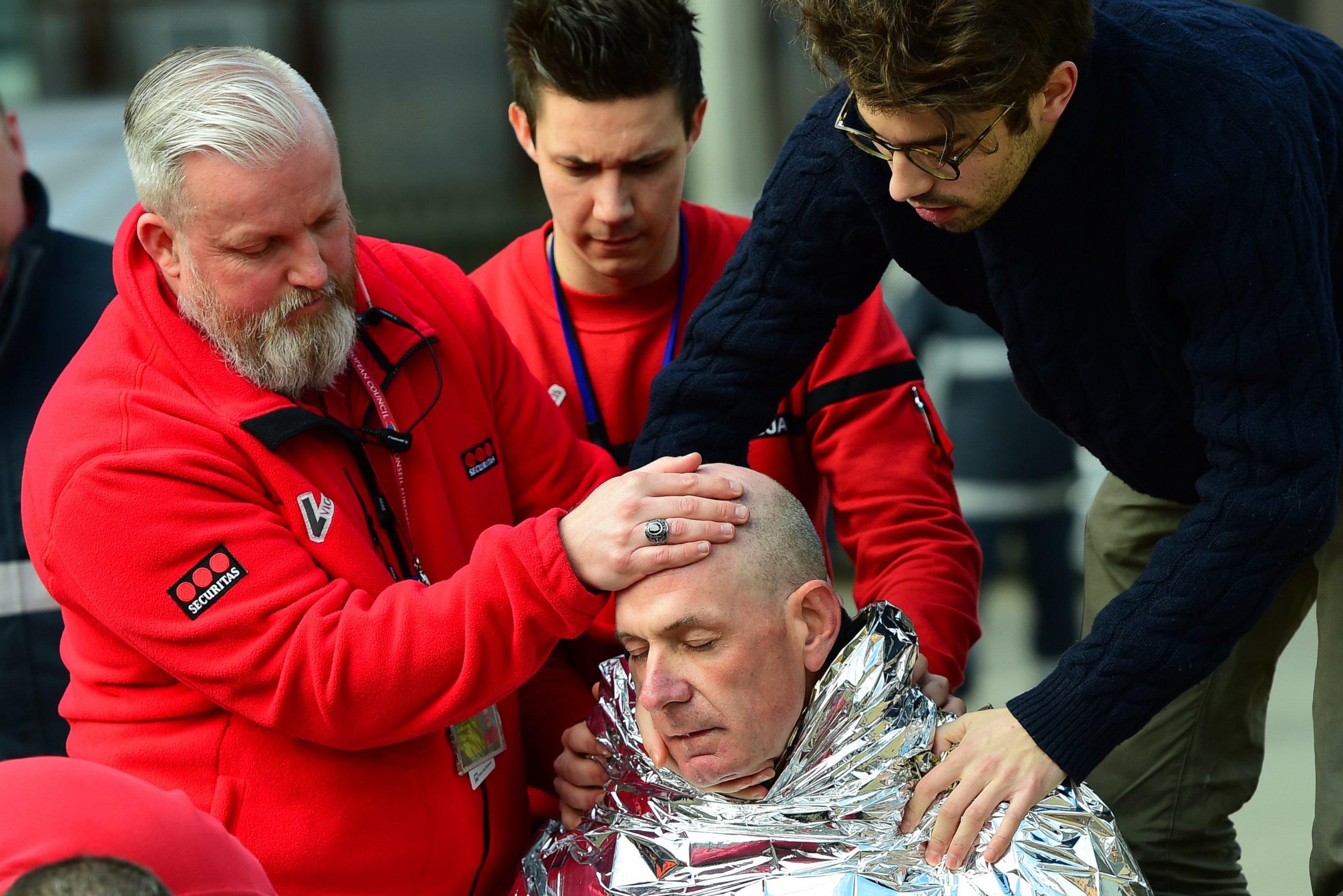 PHOTO: A victim receives first aid on March 22, 2016 near Maalbeek metro station in Brussels, after a blast at this station near the EU institutions caused deaths and injuries.