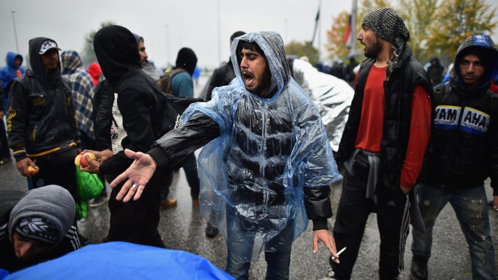 Migrants wait in the rain at the Trnovec border crossing with Slovenia as restrictions on movements have produced bottlenecks on Croatia's borders, on Oct. 19, 2015 in Trnovec, Croatia.