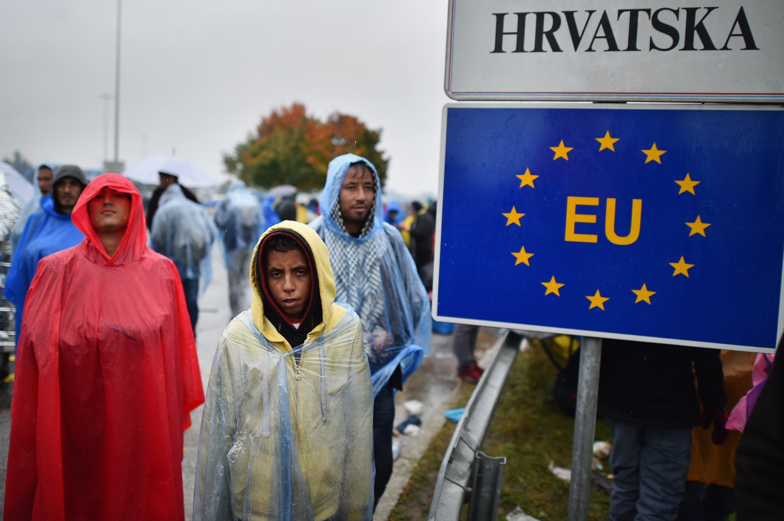 PHOTO: Migrants wait in the rain at the Trnovec border crossing with Slovenia as restrictions on movements have produced bottlenecks on Croatia's borders, on Oct. 19, 2015 in Trnovec, Croatia.