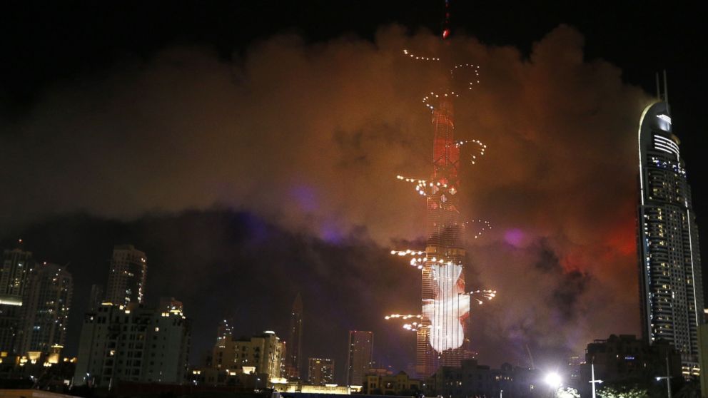 PHOTO: Smoke billows from a fire at the Address Downtown Hotel during a fireworks display at the Burj Khalifa, Jan. 1, 2016 in Dubai.