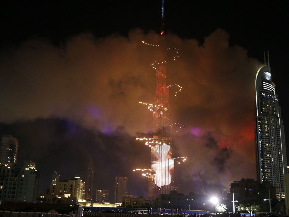 PHOTO: Smoke billows from a fire at the Address Downtown Hotel during a fireworks display at the Burj Khalifa, Jan. 1, 2016 in Dubai.