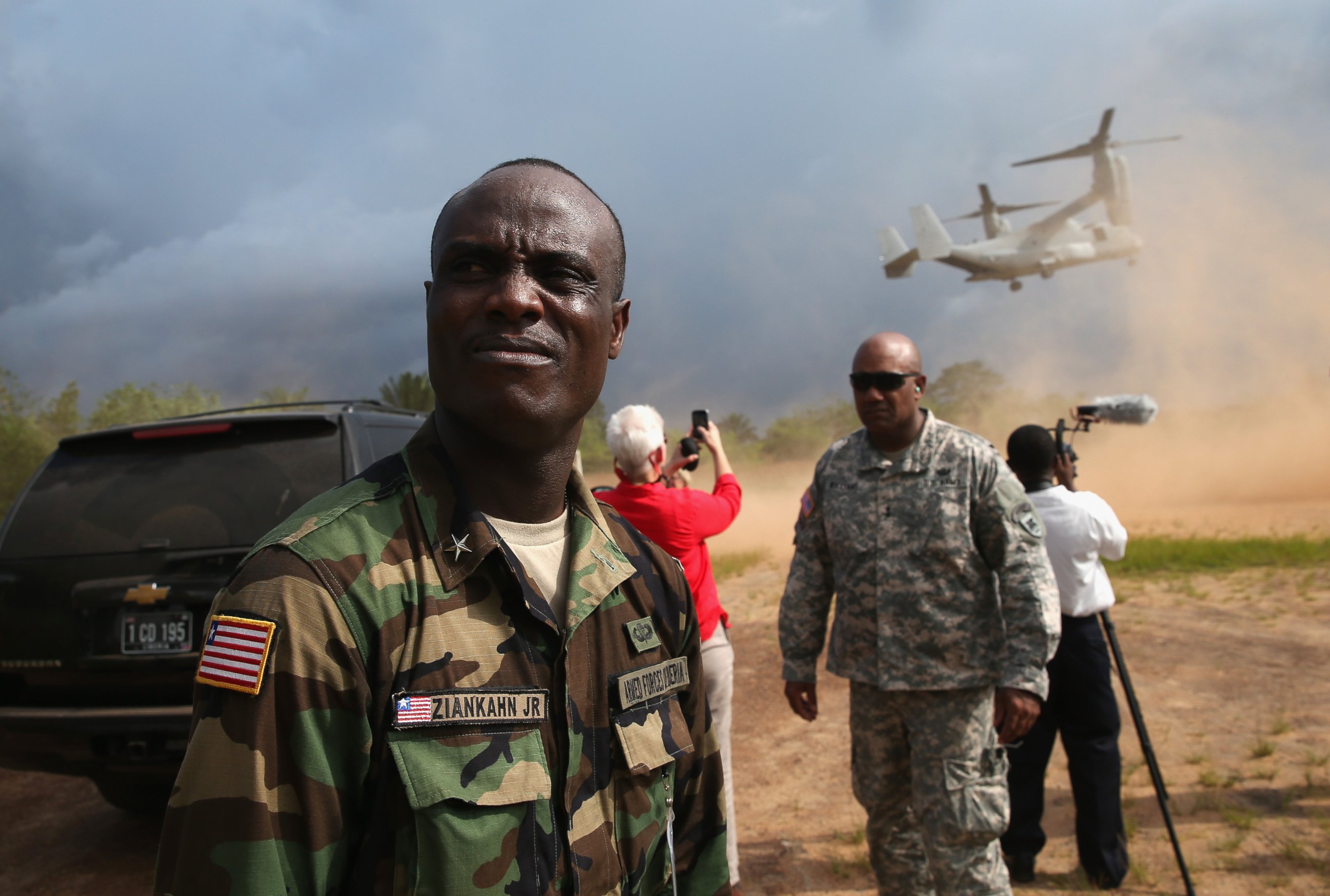 PHOTO: Liberian Brig. Gen. Daniel Ziankhan, and American Maj. Gen. Darryl Williams (2nd R), visit the construction site of a new Ebola treatment center, Oct. 15, 2014 in Tubmanburg, Liberia. 