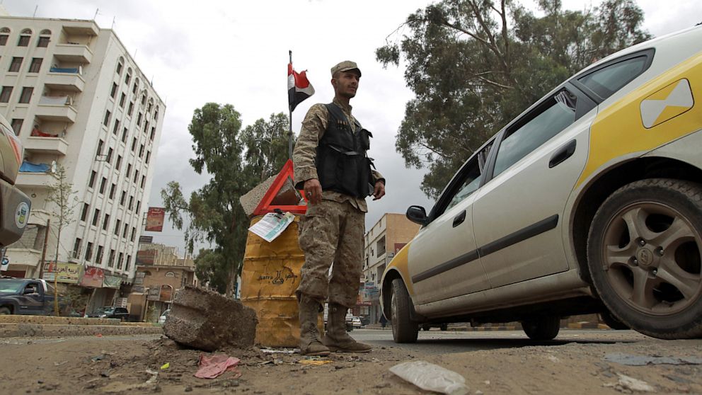 PHOTO: A Yemeni policeman stands at a check point in the capital Saana on August 3, 2013.
