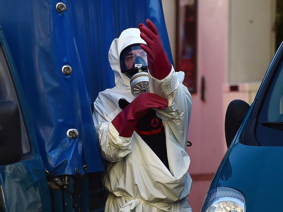 PHOTO: A decontamination unit worker suits up in front of Brussels Great Mosque in Brussels on Nov. 26, 2015.