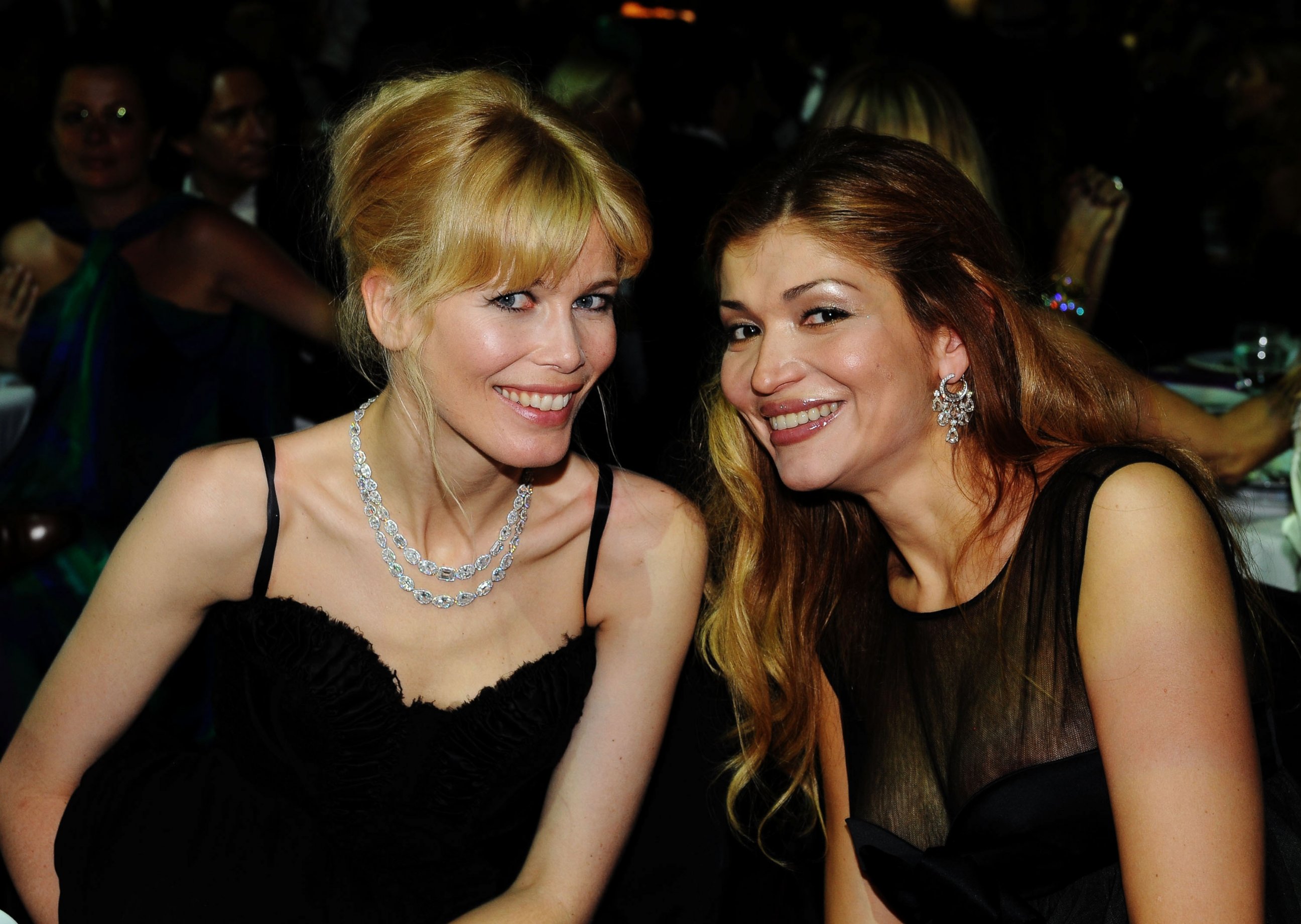 PHOTO: Claudia Schiffer and Gulnora Karimova attend the amfAR Cinema Against AIDS 2009 dinner at the Hotel du Cap during the 62nd Annual Cannes Film Festival on May 21, 2009 in Antibes, France.