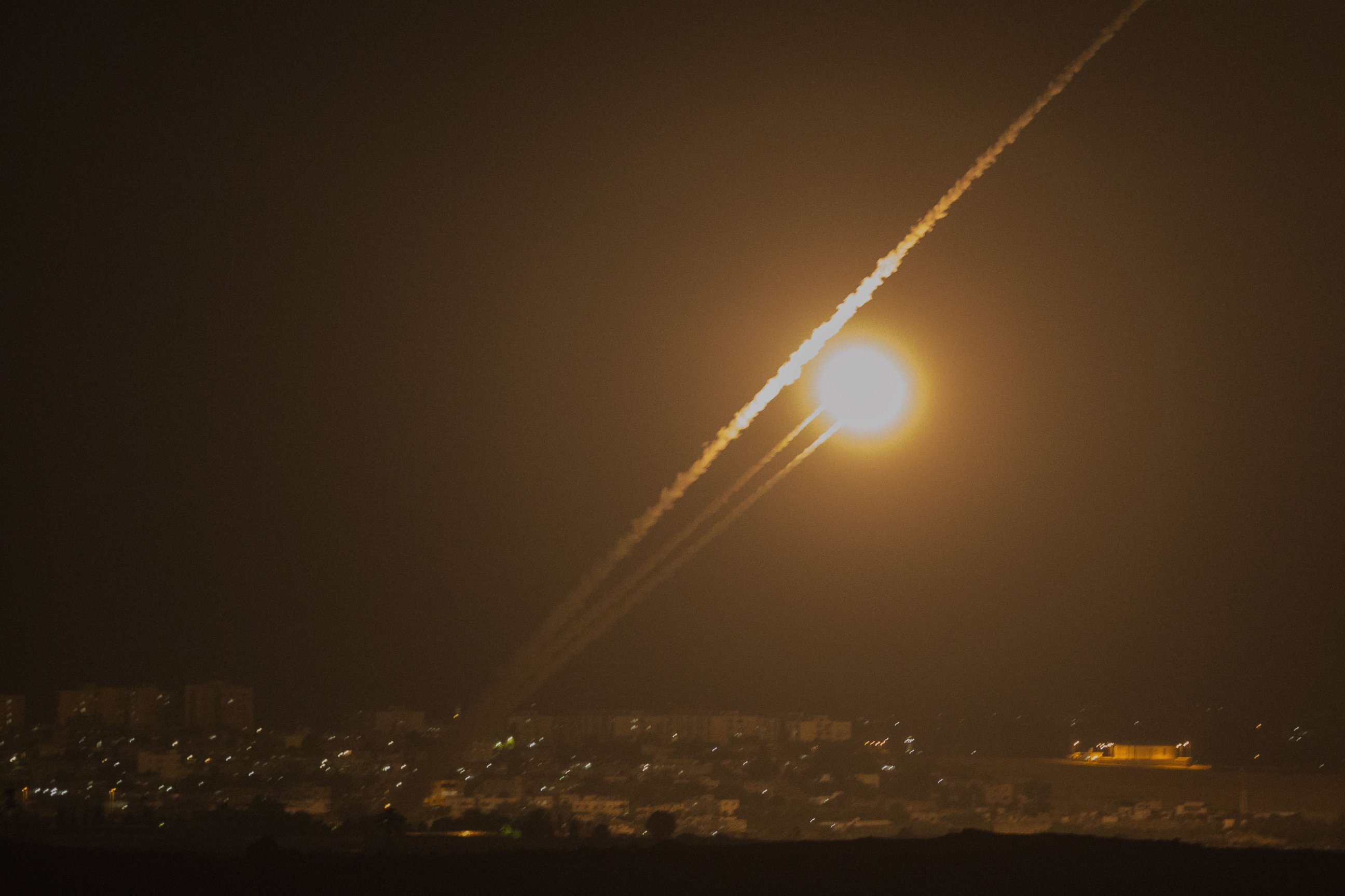 PHOTO: A picture taken from the southern Israeli Gaza border shows rockets being fired from the Gaza strip into Israel, on July 12, 2014. 