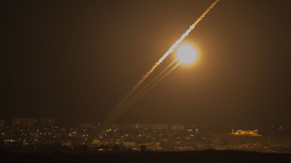 PHOTO: A picture taken from the southern Israeli Gaza border shows rockets being fired from the Gaza strip into Israel, on July 12, 2014.