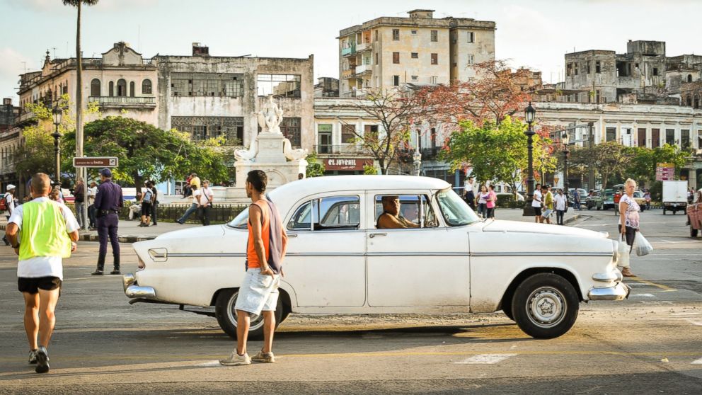 A driver waits for passengers in his old American car in Havana, Cuba on Jan. 20, 2015.