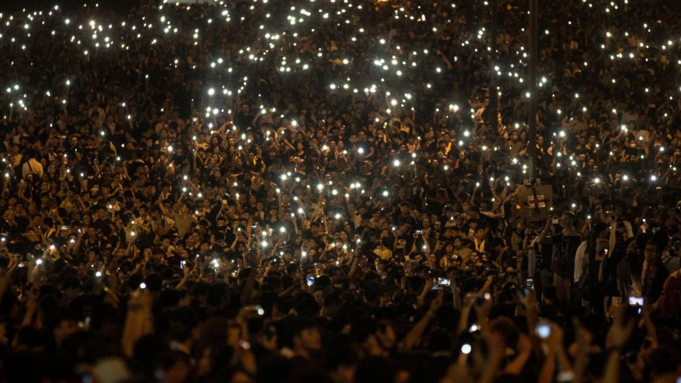 PHOTO: Protesters wave their cell phones in the air in the streets outside the Hong Kong Government Complex on Sept. 29, 2014 in Hong Kong. 