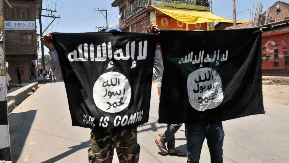 Kashmiri protesters displaying the flags of ISIS during a protest on June 27, 2015 in Srinagar, India. 