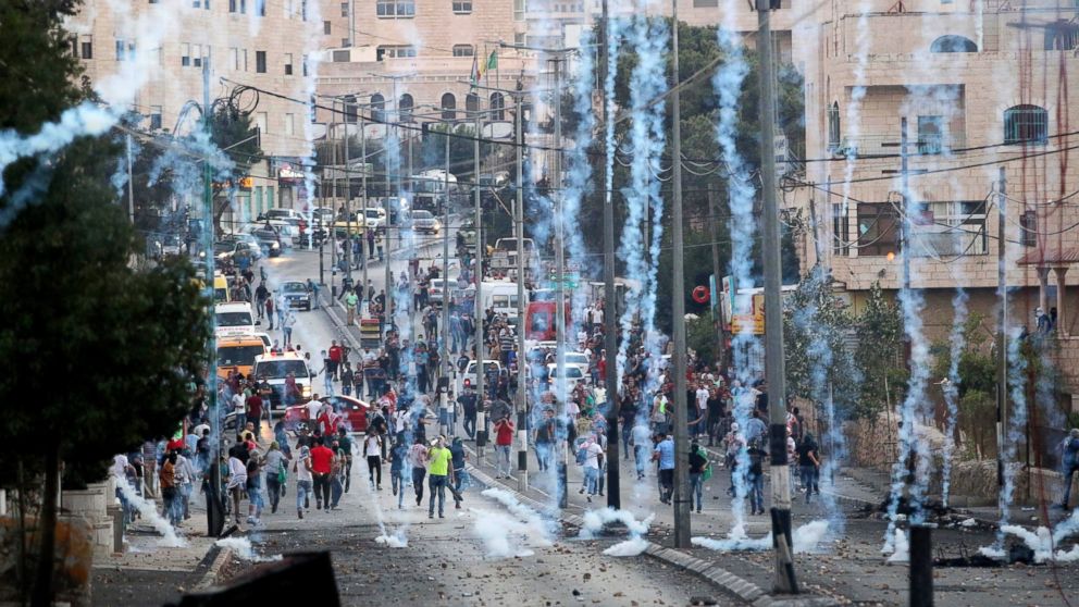 PHOTO: Palestinians run after Israeli soldiers used tear gas to disperse them during clashes with Israeli soldiers in Bethlehem, West Bank on Oct. 16, 2015. 