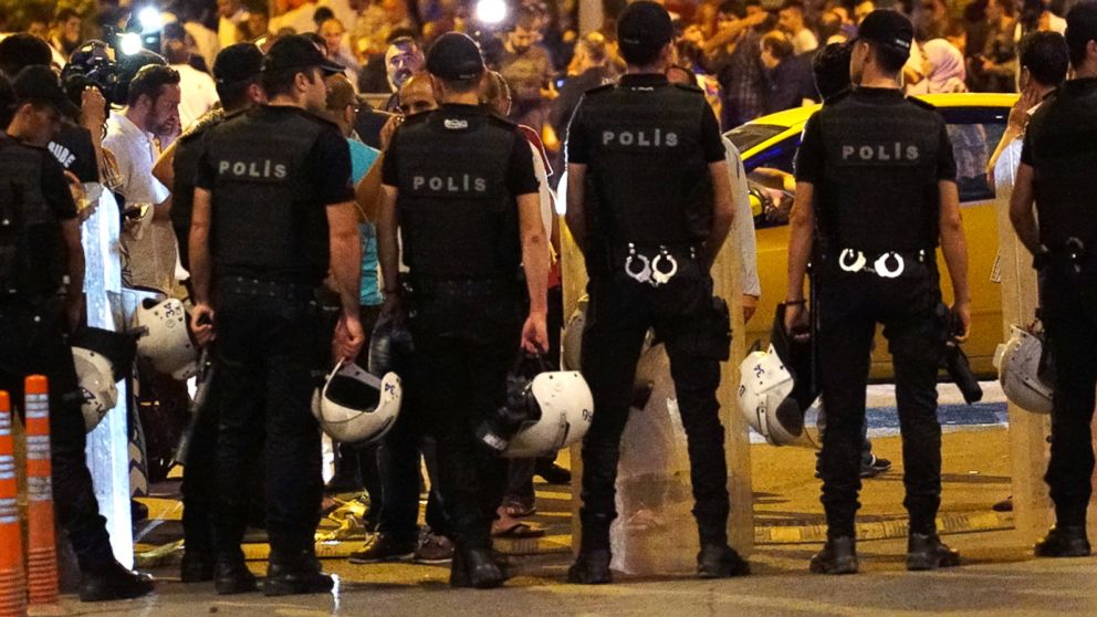 Turkish police blocks the road as relatives wait outside the Turkey's largest airport, Istanbul Ataturk, following the suicide bomb attack, June 28, 2016 in Istanbul, Turkey. 