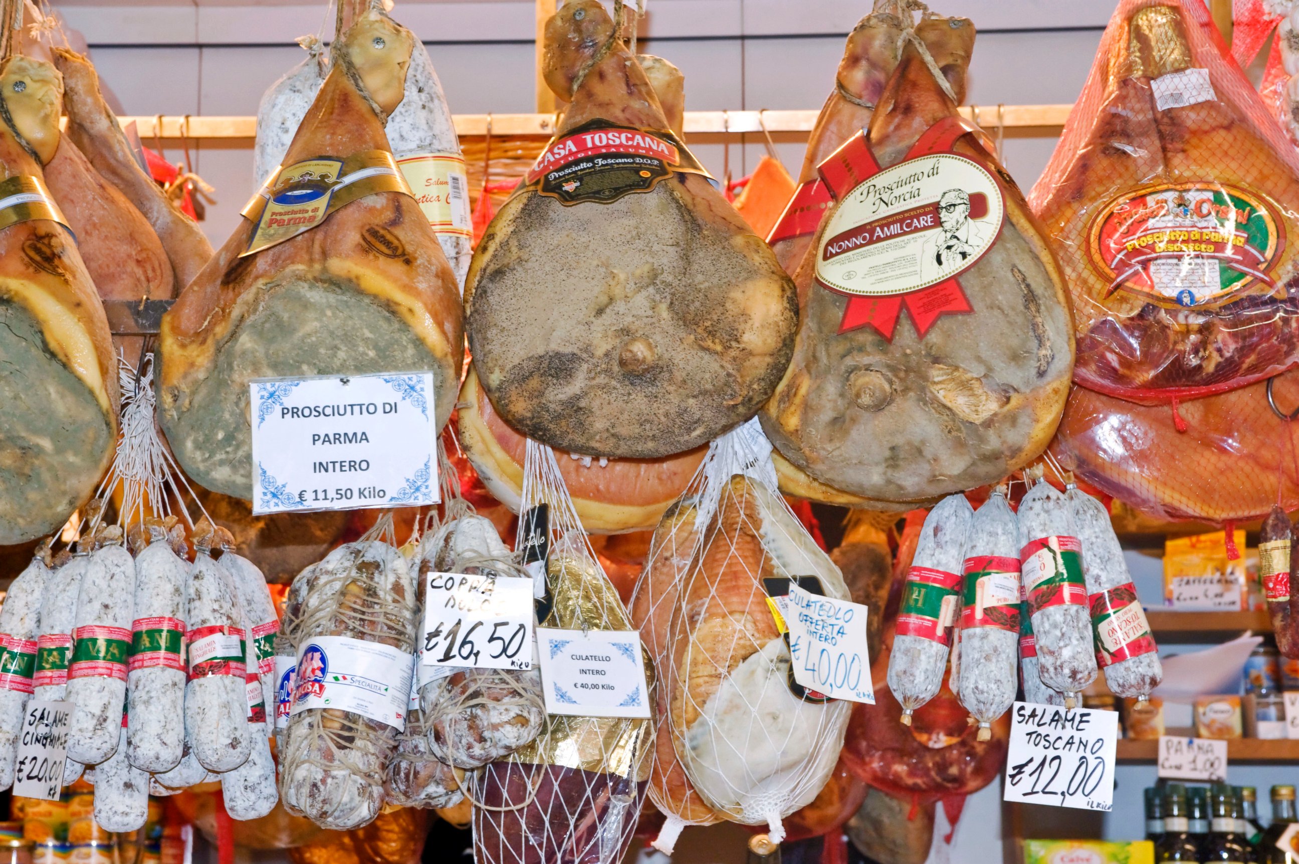 PHOTO: Prosciutto, hams, and salami for sale at a market in Florence, Italy.