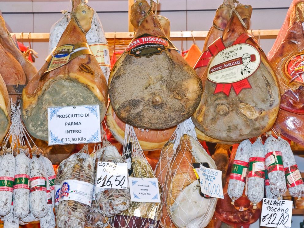 PHOTO: Prosciutto, hams, and salami for sale at a market in Florence, Italy.