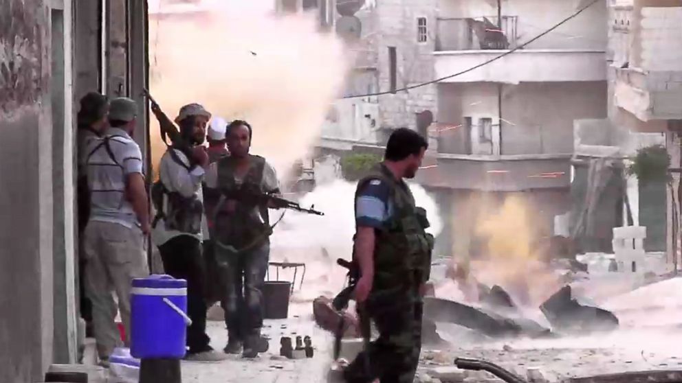 PHOTO: An image grab taken from AFP TV shows Syrian rebels taking position during clashes with Syrian regime forces in the Amariyeh district of the northern city of Aleppo in this Aug. 31, 2012 file photo. 