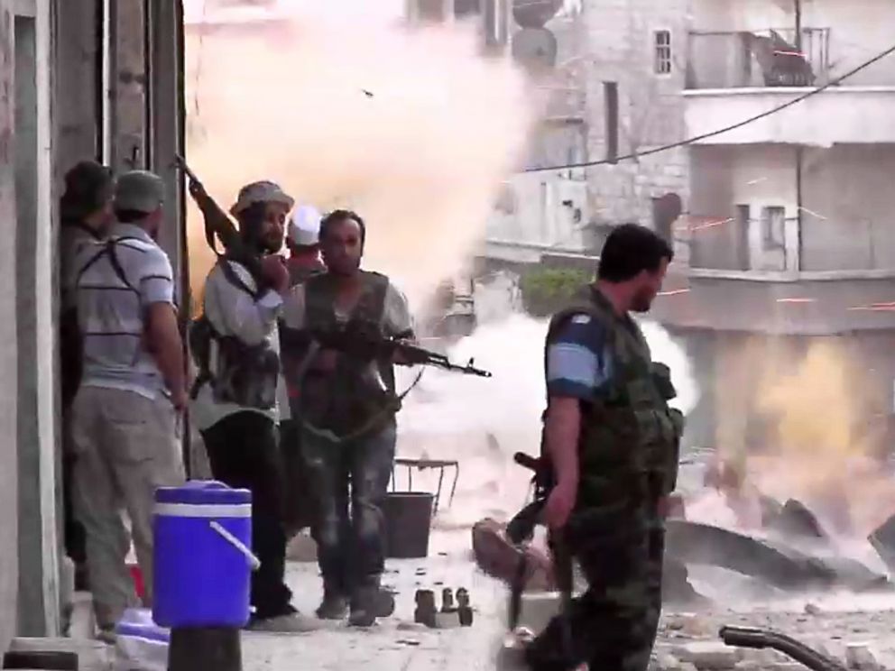 PHOTO: An image grab taken from AFP TV shows Syrian rebels taking position during clashes with Syrian regime forces in the Amariyeh district of the northern city of Aleppo in this Aug. 31, 2012 file photo.