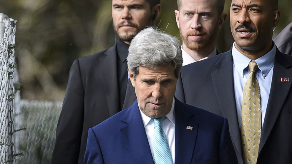 Secretary of State John Kerry walks in the garden of the Beau-Rivage Palace hotel during a break in Iran nuclear talks in Lausanne, Switzerland, on April 1, 2015.