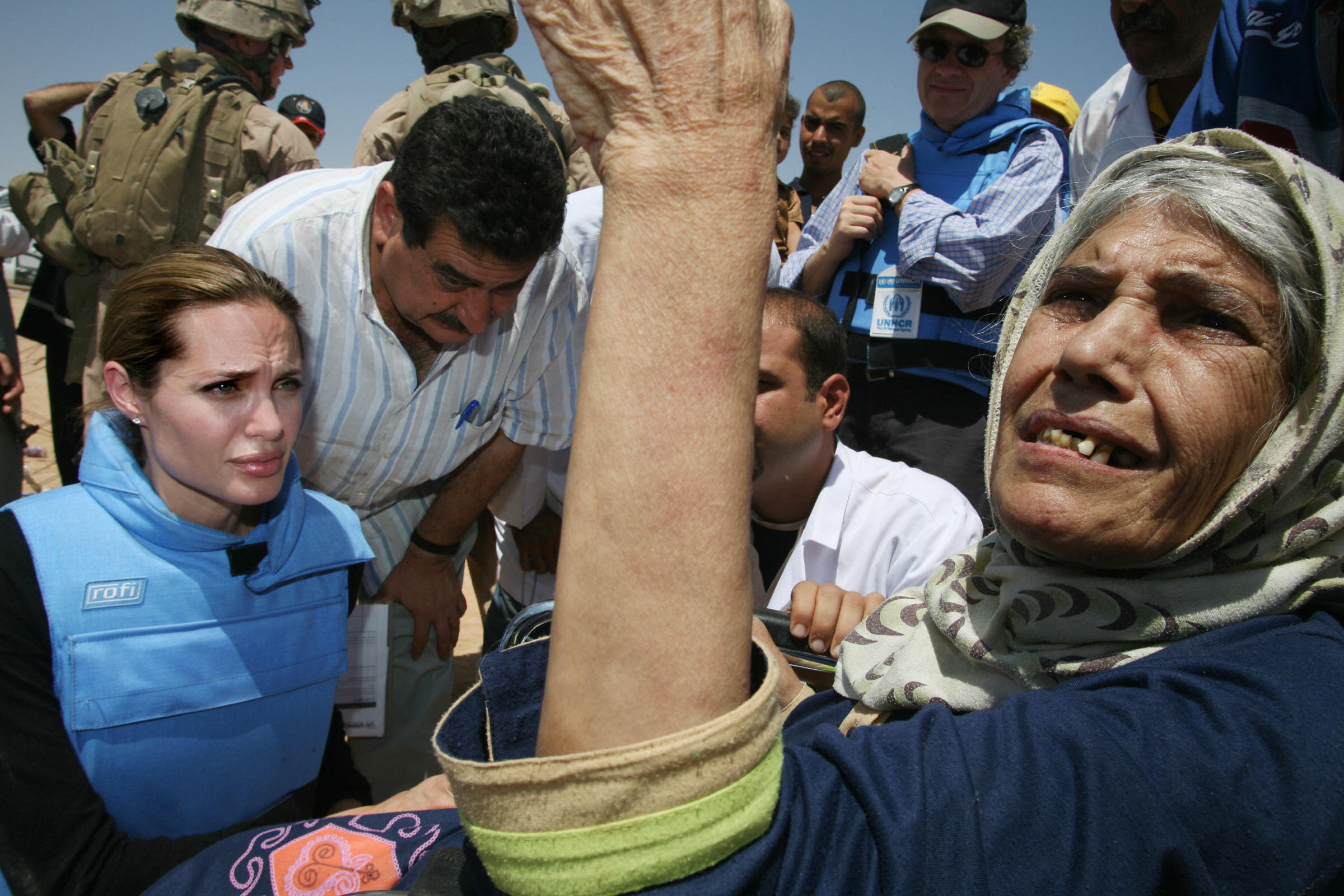 PHOTO: Angelina Jolie meeting an elderly refugee, one some 1,300 trapped at the makeshift Al Waleed camp inside Iraq, unable to leave the country for neighboring Syria, Aug. 28, 2007. 