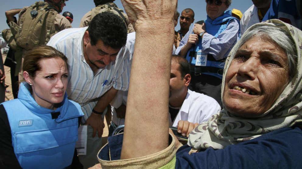 PHOTO: Angelina Jolie meeting an elderly refugee, one some 1,300 trapped at the makeshift Al Waleed camp inside Iraq, unable to leave the country for neighboring Syria, Aug. 28, 2007.