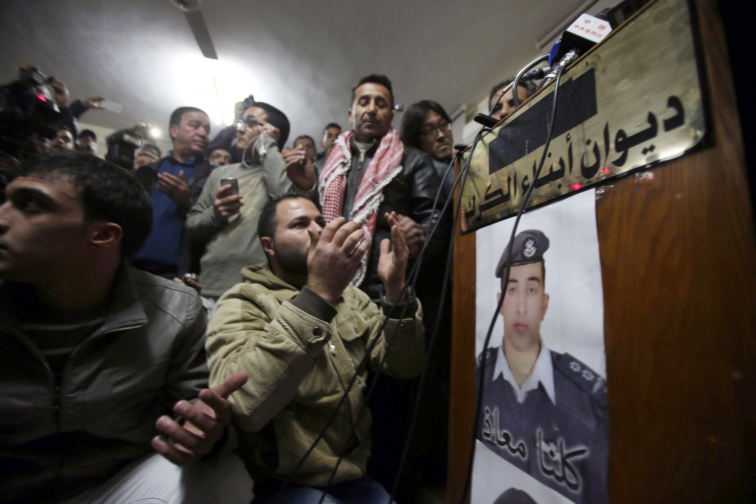 PHOTO: A man prays for Jordanian pilot Muath al-Kasasbeh after hearing the news of his execution at the Kasasbeh tribe society on Feb. 3, 2015 in Amman, Jordan.