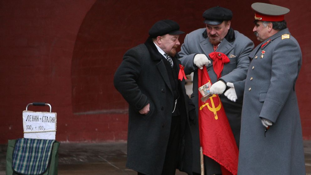 PHOTO: In this Jan. 2009 file photo, lookalikes of two Vladimir Lenins, left,  and a Josef Stalin, right, speak near Red square in Moscow.