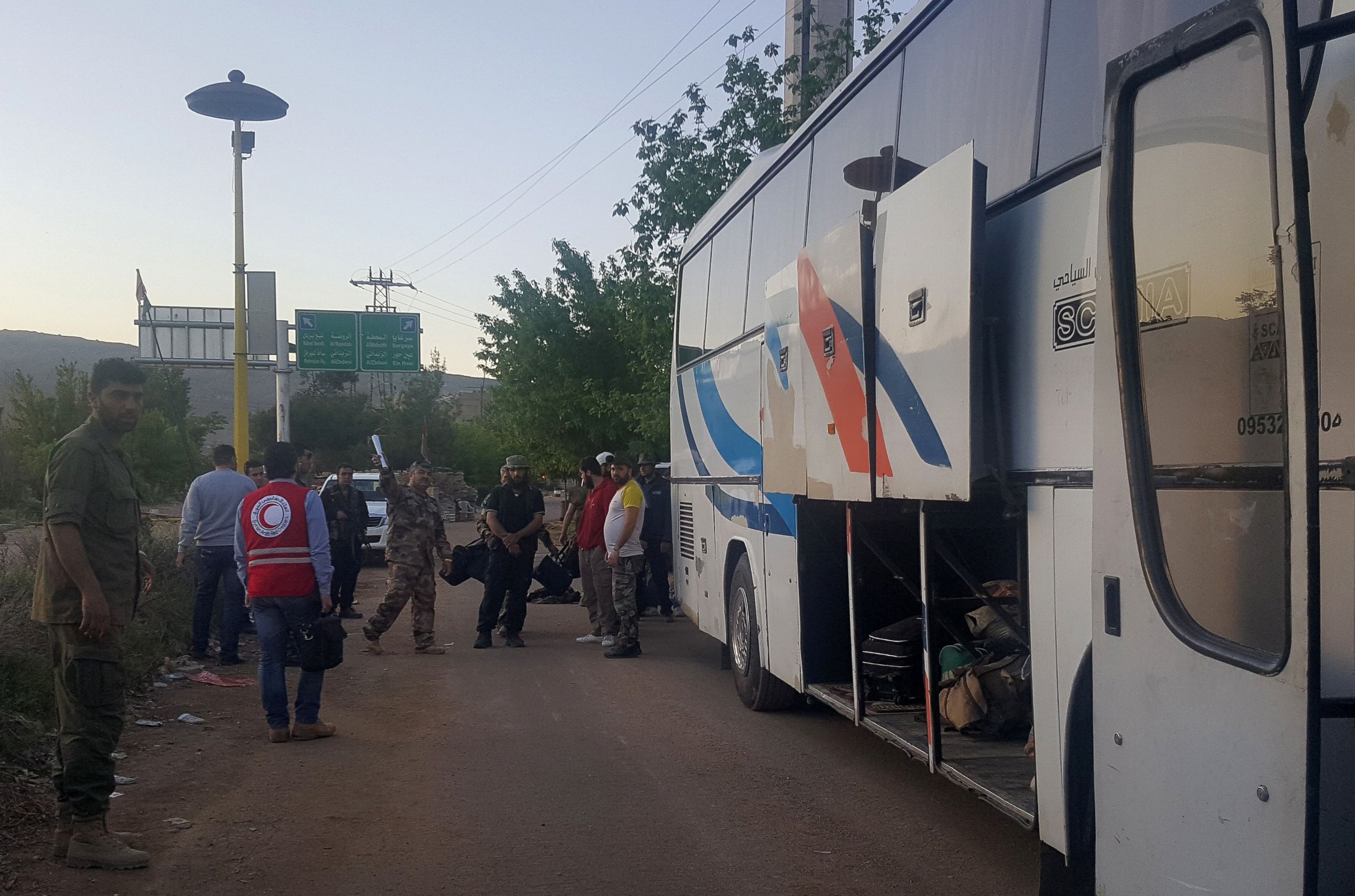 PHOTO: Syrians prepare to board a bus to leave the besieged town of Madaya, on April 20, 2016 during an operation to evacuate hundreds of wounded people from besieged Syrian towns.
