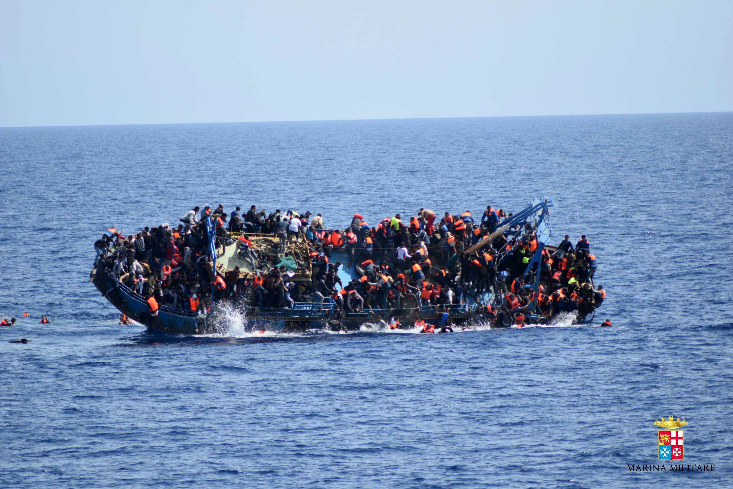 PHOTO: A handout picture from the Italian Navy shows the shipwreck of an overcrowded boat of migrants off the Libyan coast, May 25, 2016.